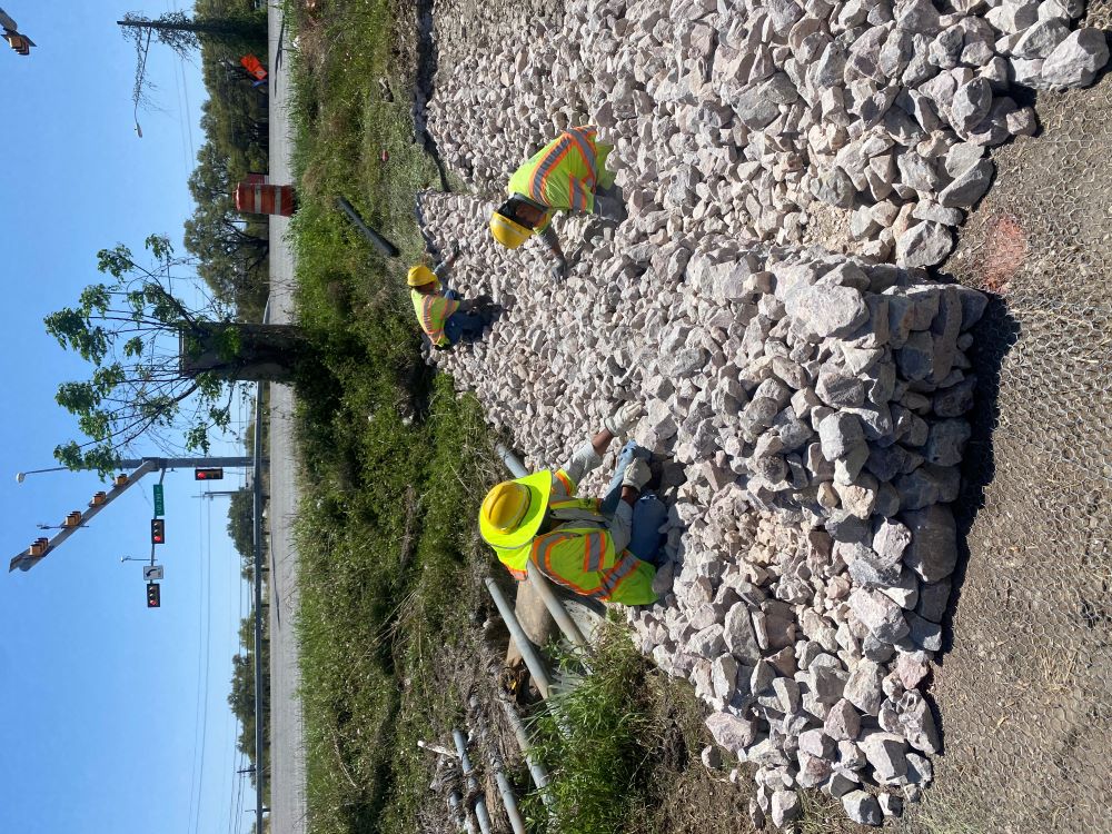 Oak Hill Parkway crews construct a rock filter dam at US 290 near Convict Hill Road. Installation of these water quality best management practices help the team meet all TCEQ Edwards Aquifer requirements. April 2022